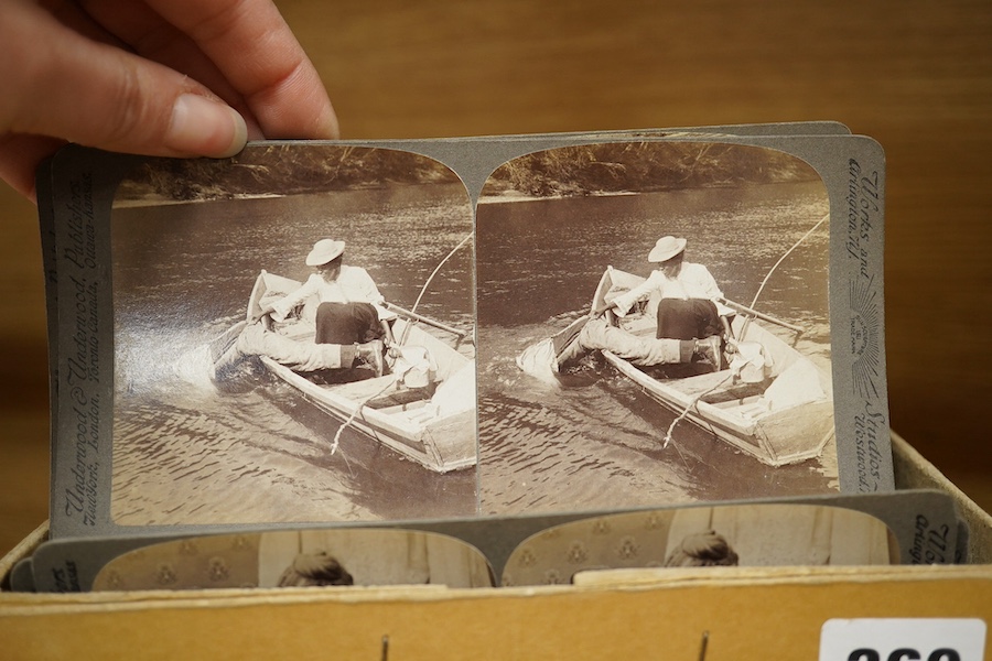 A stereoscope viewer with a collection of comical viewing cards. Condition - cards - fair/good, viewer - poor